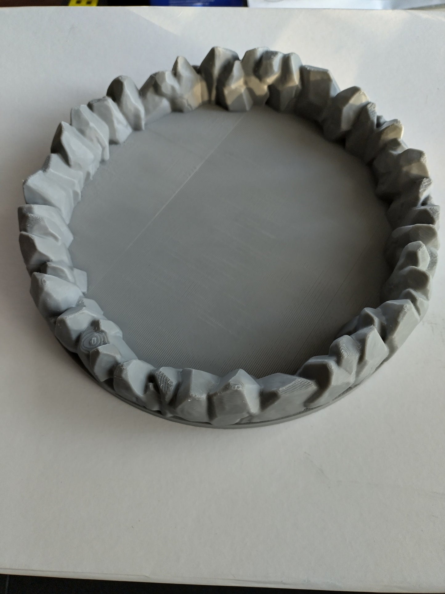 Dice tray decorated with a ring of stones