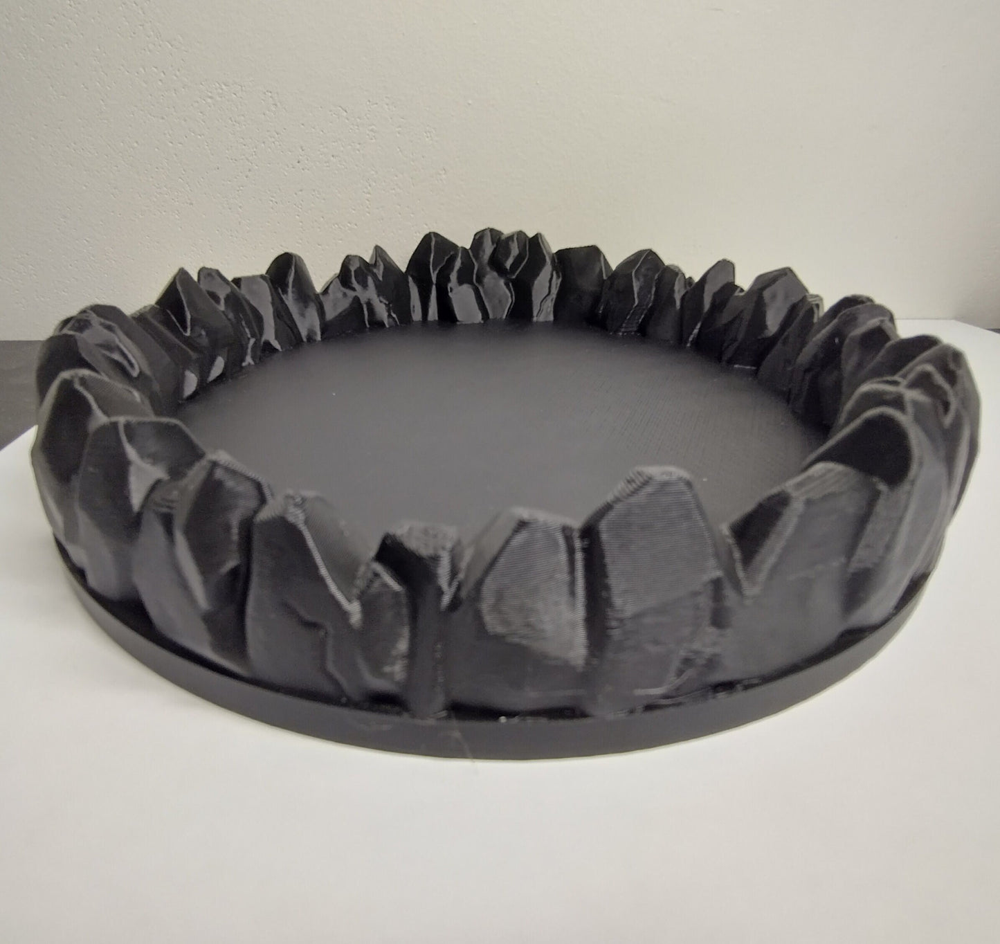 Dice tray decorated with a ring of stones